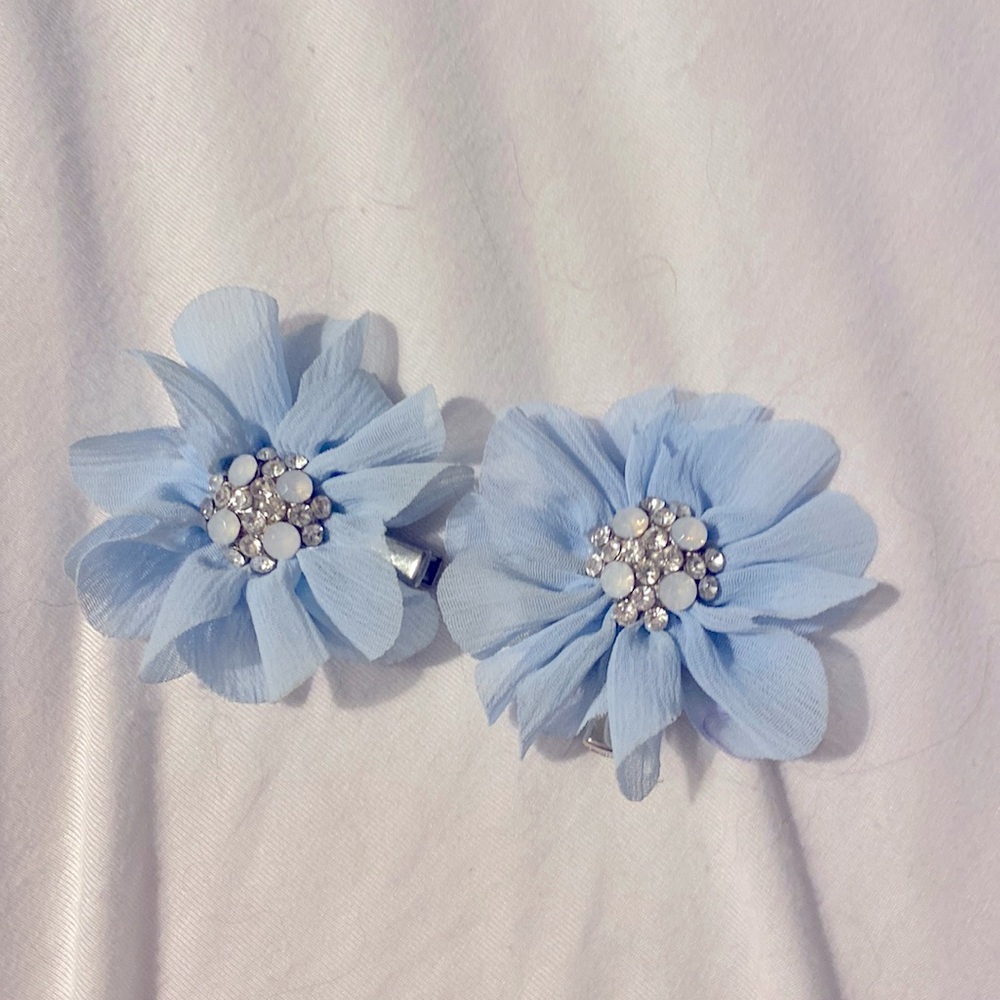 Two blue flower hair clips